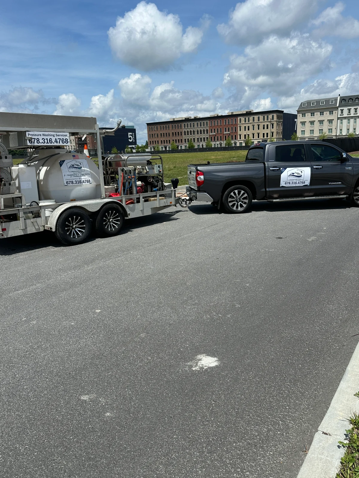 Professional pressure washing equipment and cleaning supplies ready for service.